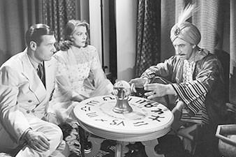 1950s couple visiting a fortune-teller