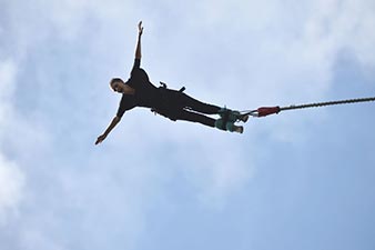 Bungy jumper in mid-air