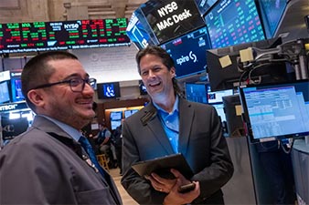 Two stockbrokers on the trading floor
