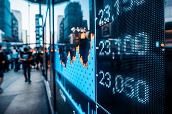 Share prices and graphs displayed on an electronic board