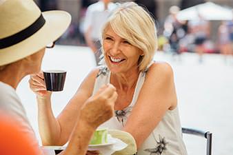 Women enjoying a coffee in an outdoor cafe